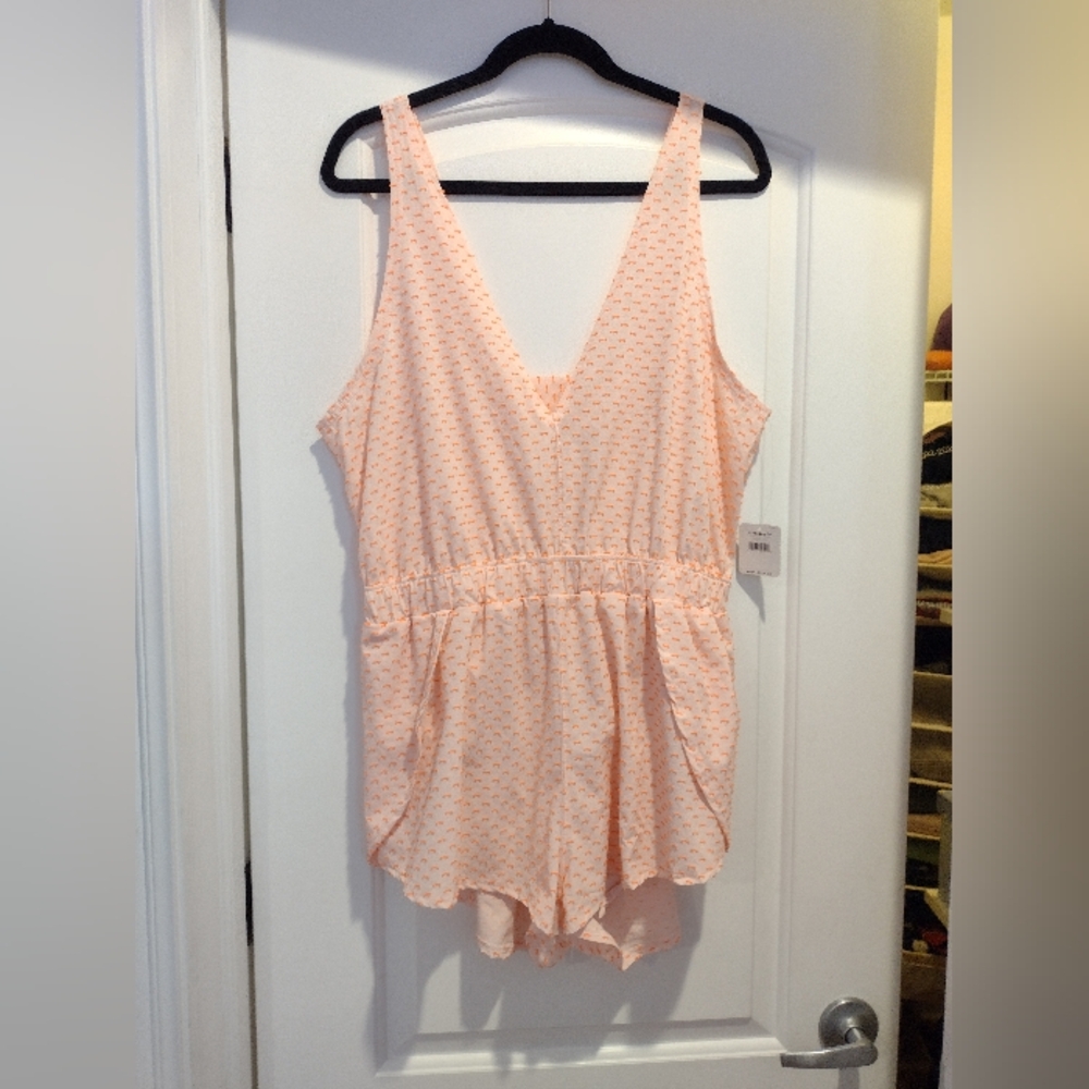 Free people orange romper w/ open back and small back pocket size large NWT